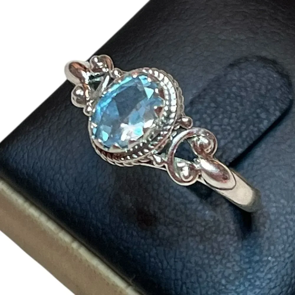 Elegant Sterling Silver and Blue Topaz Gemstone Ring Size 10